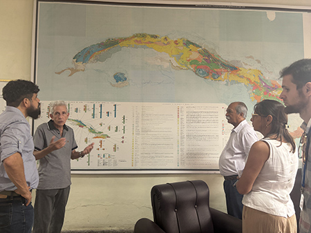 A group of people standing in front of a map

AI-generated content may be incorrect.
